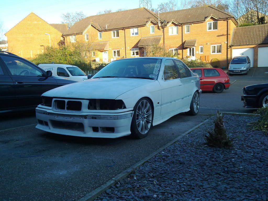 White BMW 7 Series on Wooden