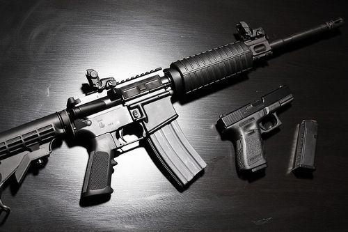 AR-15 rifle and Glock handgun AR-15 rifle and Glock handgun